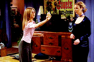 Rachel spraying Phoebe with perfume in Friends